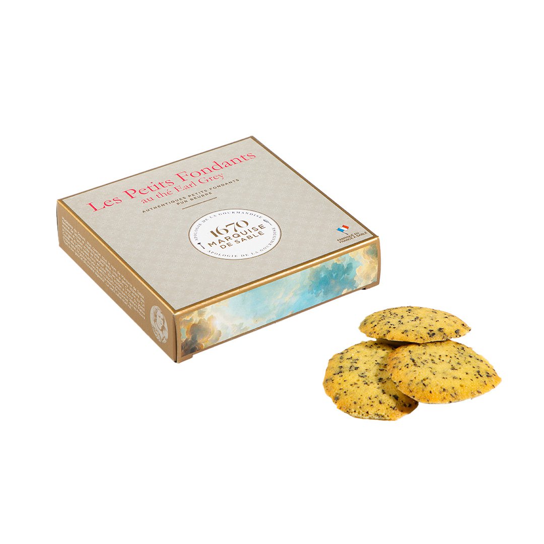 Box of Les Petits Fondants cookies with cookies displayed in front on a white background