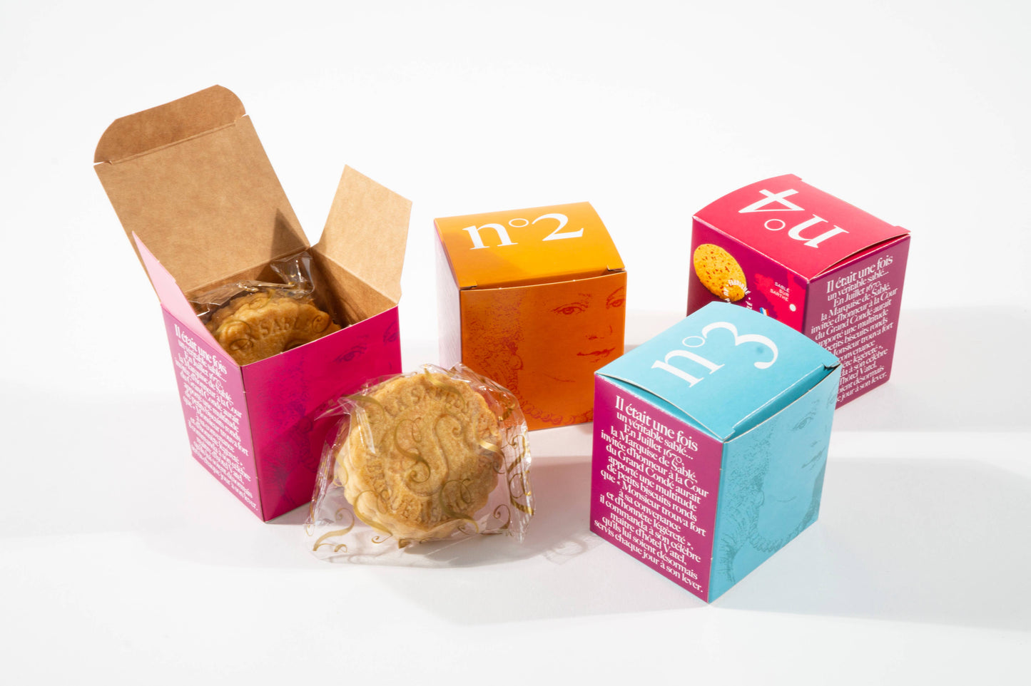 Colorful boxes with cookies on a white background