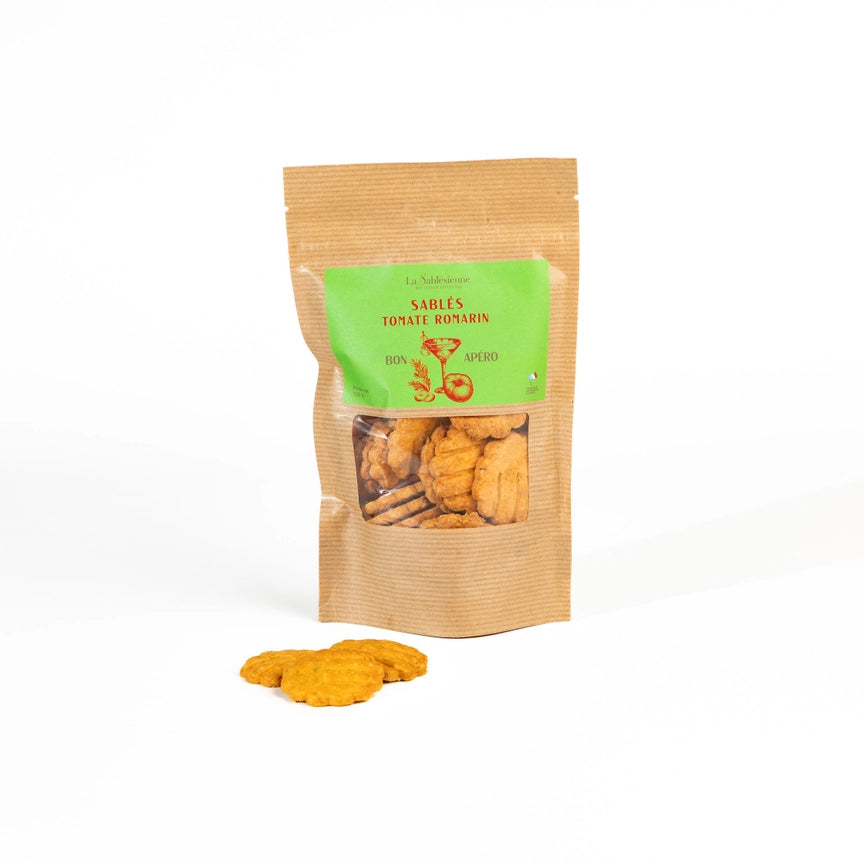 Kraft paper packaging with green label containing dried snacks on a white background