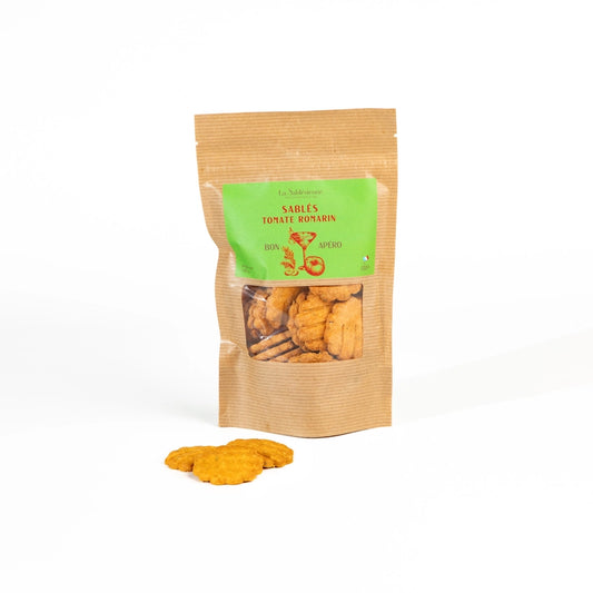 Kraft paper packaging with green label containing dried snacks on a white background