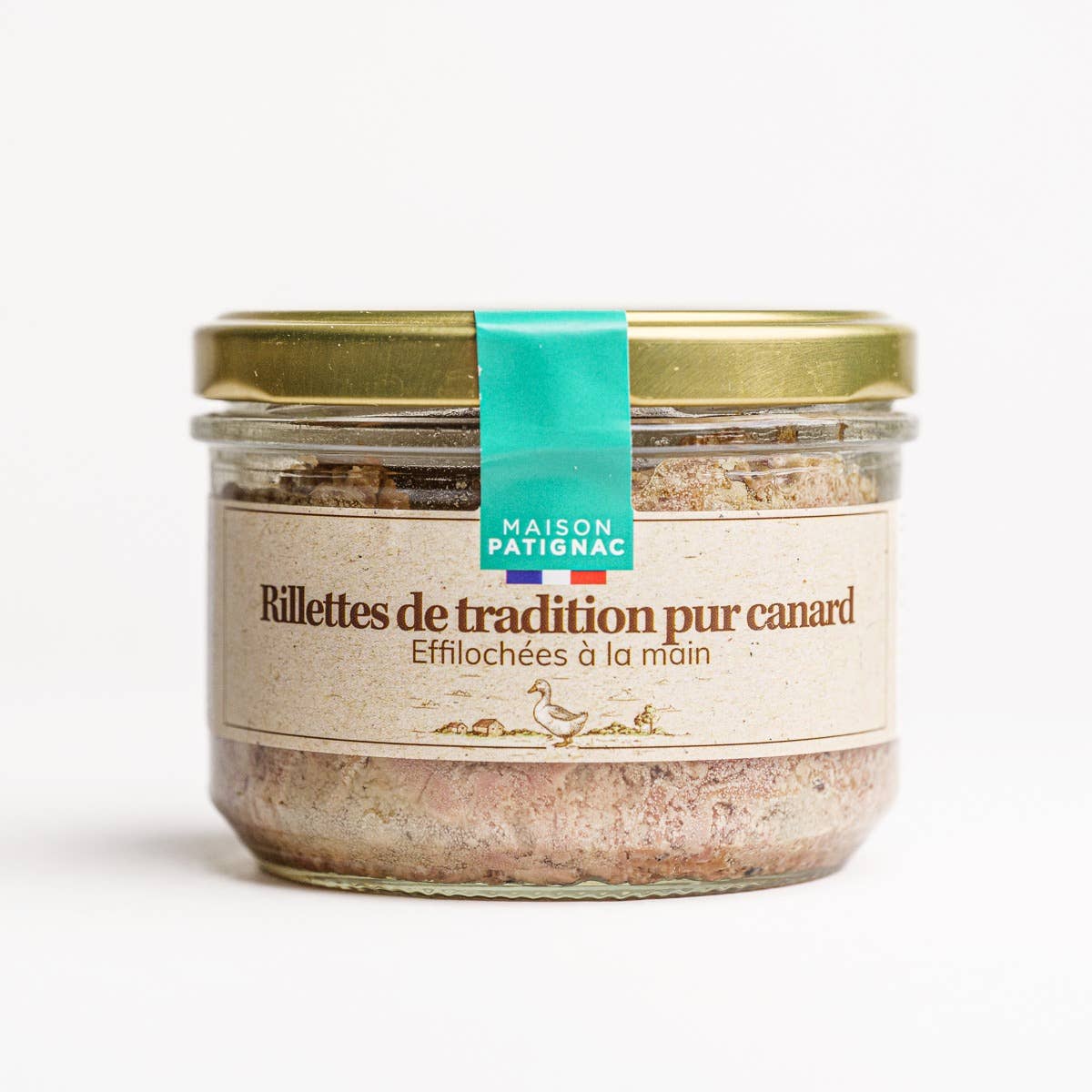 Jar of Maison Patignac duck rillettes with a gold lid on a white background