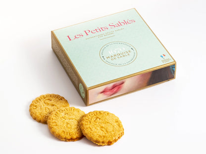 Box of 'Les Petits Sables' cookies with cookies displayed in front on a white background