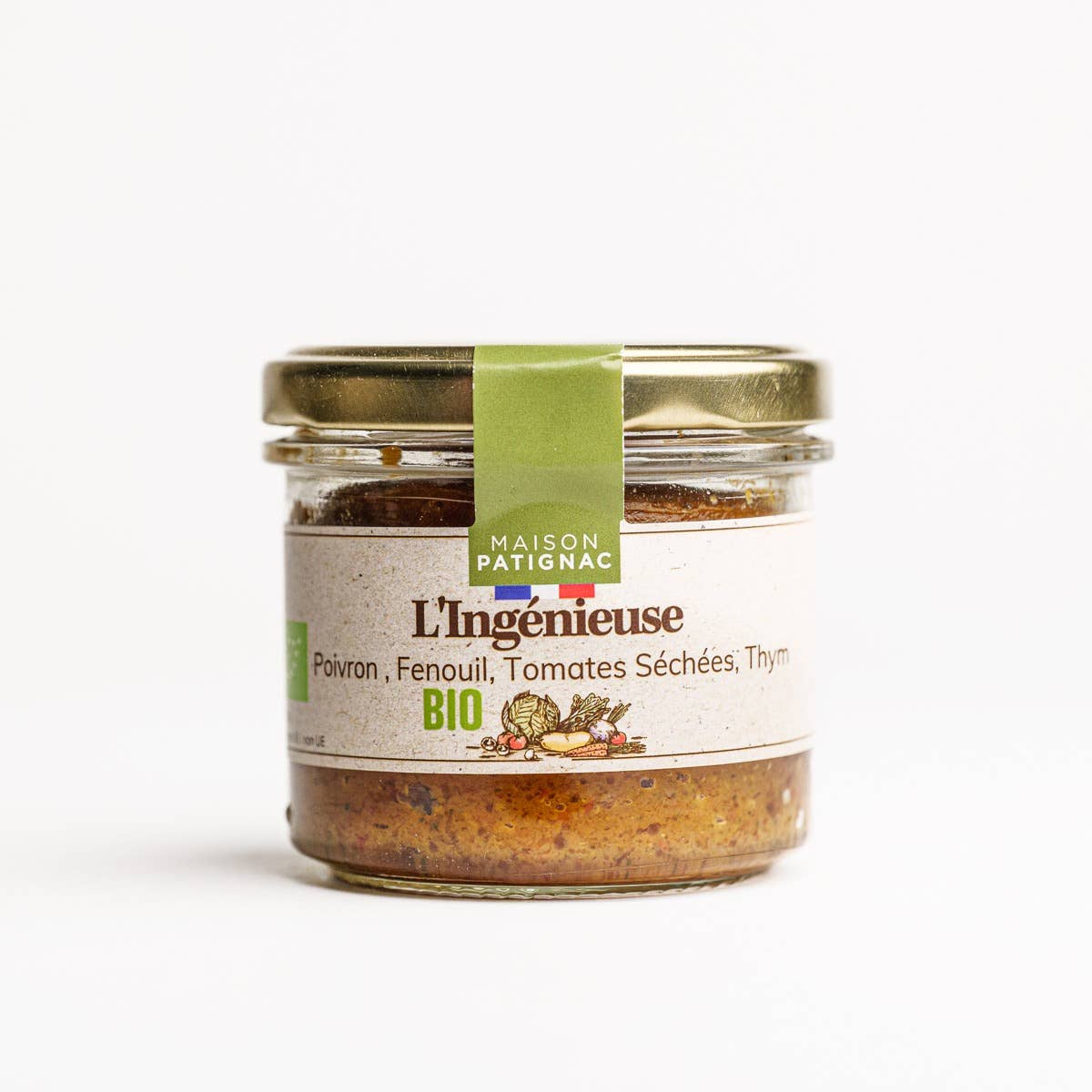 Jar of L'Ingénieuse spread with a green label on a white background