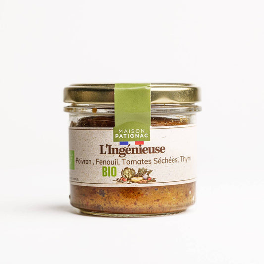 Jar of L'Ingénieuse spread with a green label on a white background