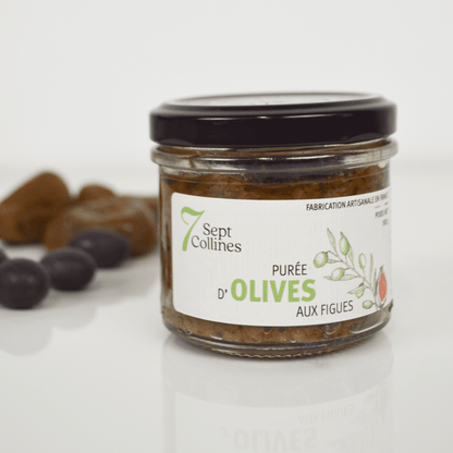 Jar of olive spread with a visible label on a white background