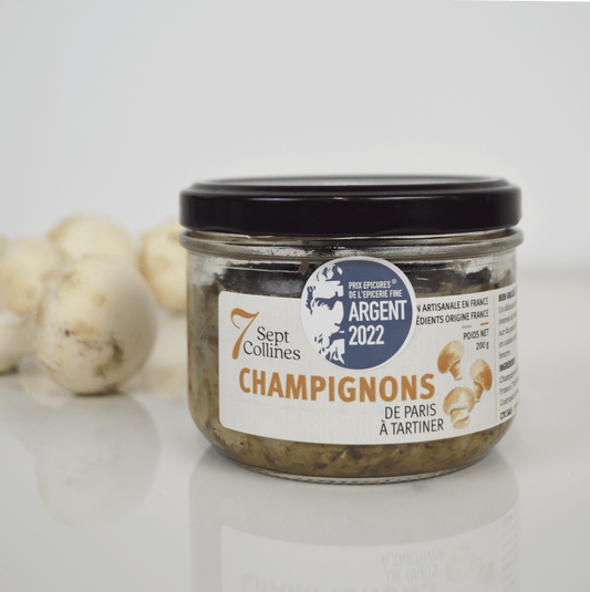 Jar of 'Champignons' with a label on a white background
