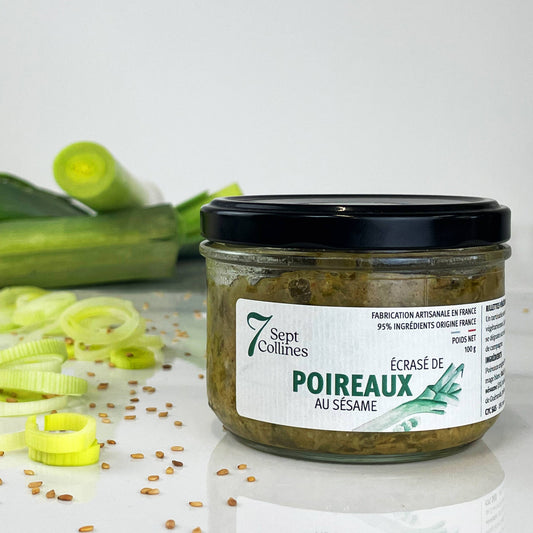 Jar of '7 Sept Collins' leek spread with sesame seeds on a white background
