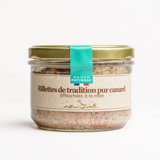 Jar of Maison Patignac duck rillettes with a gold lid on a white background